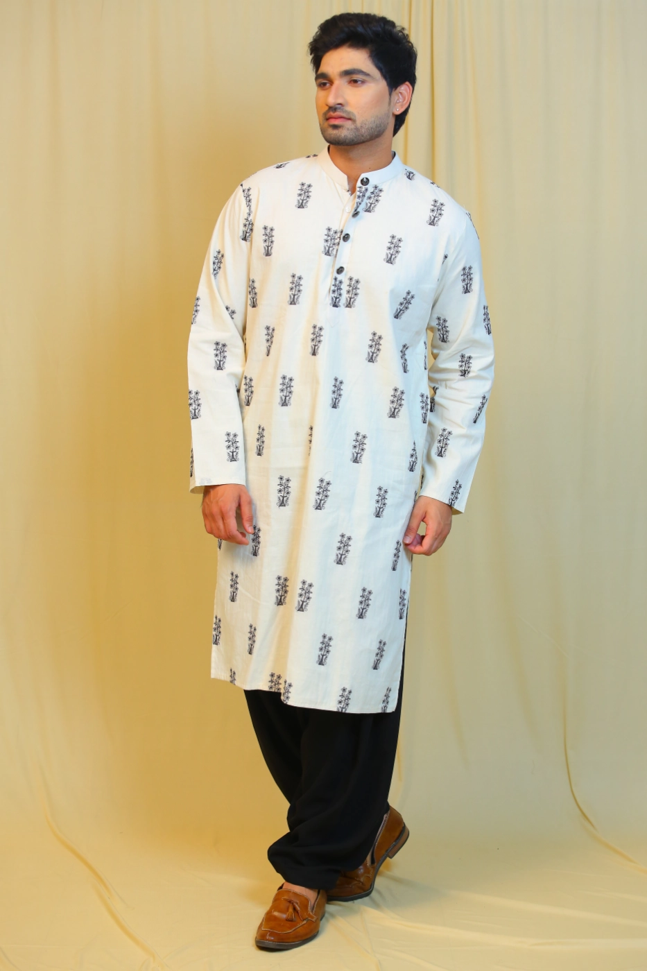 of-white-cotton-kurta-with-black-embroidered-motifs-paired-with-black-patiala-l?uid=1674825453