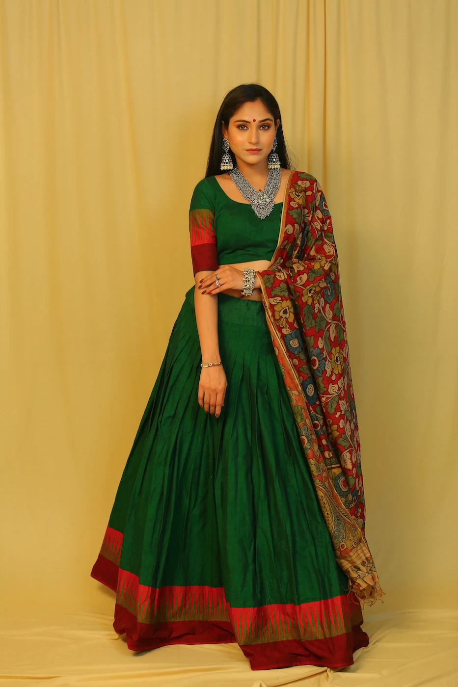 emerald-green-mangalagiri-cotton-lehenga--blouse-with-maroon-temple-border-and-red-pen-kalamkari-dupatta-s?uid=1676349365