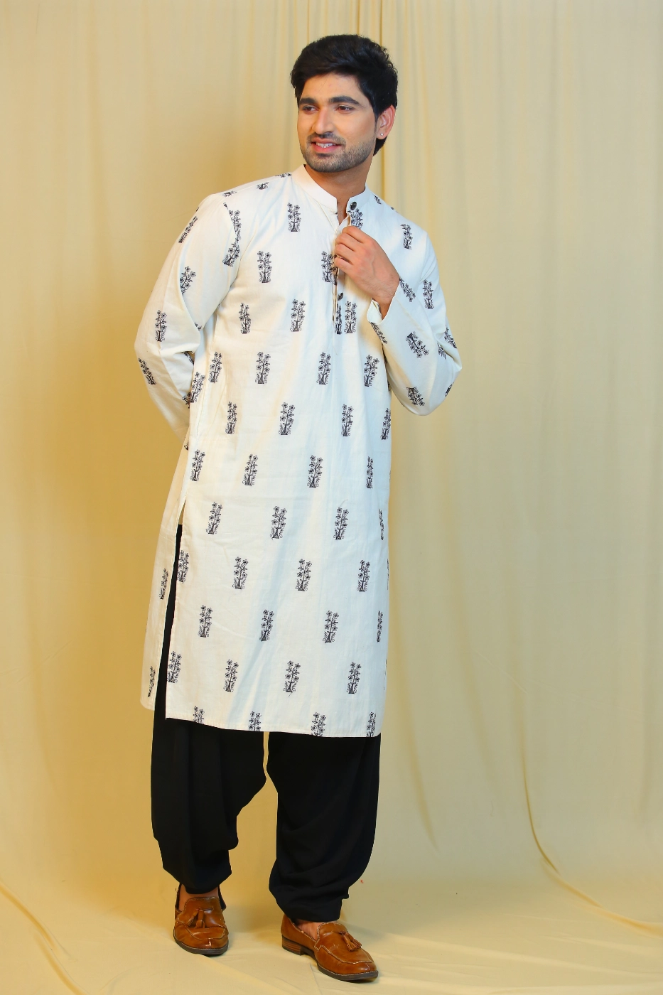 of-white-cotton-kurta-with-black-embroidered-motifs-paired-with-black-patiala-l?uid=1674825453