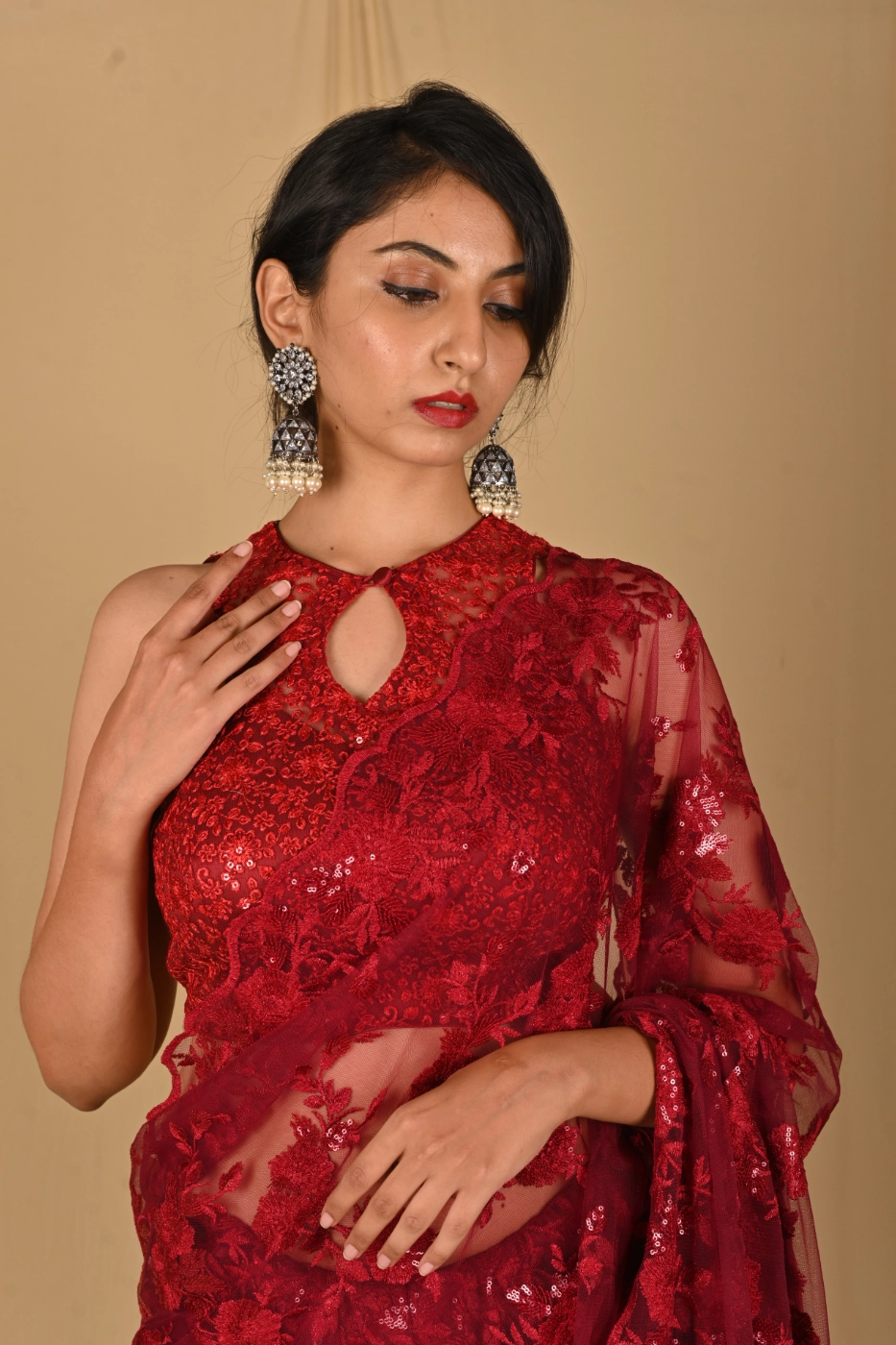 maroon-net-saree-with-all-over-sequin-embroidery-paired-with-matching-sleeveless-halter-neck-blouse-custom-tailored?uid=1674831134