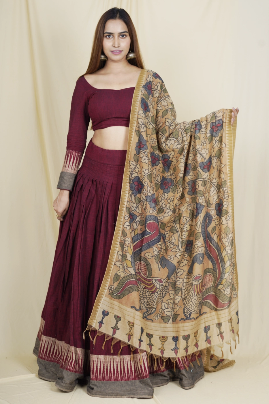 maroon-mangalagiri-cotton-lehenga-with-brown-temple-border-paired-with-matching-blouse-and-brown-pen-kalamkari-dupatta-s?uid=1675052096