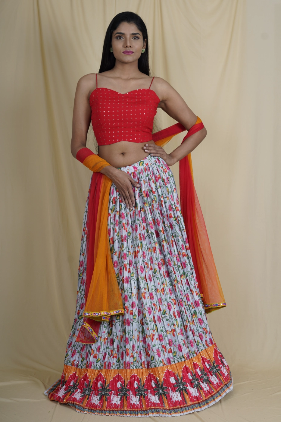 grey-crushed-crepe-lehenga-with-red-and-orange-floral-print-and-border-paired-with-red-sequin-embroidered-crop-top-and-matching-double-shade-dupatta-s?uid=1675052814