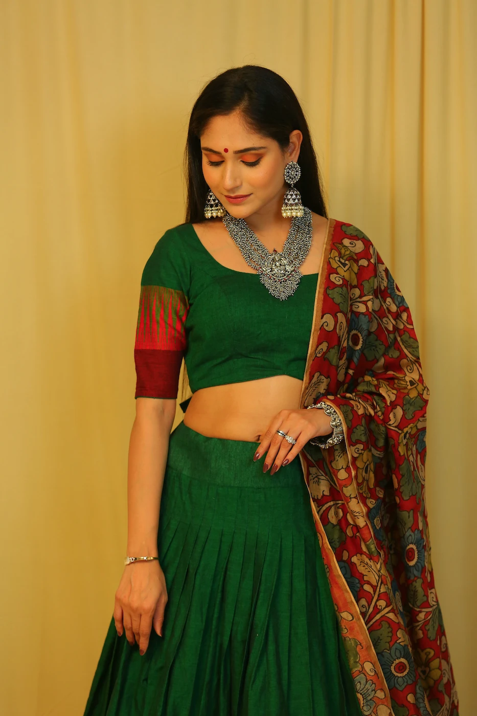 emerald-green-mangalagiri-cotton-lehenga--blouse-with-maroon-temple-border-and-red-pen-kalamkari-dupatta-s?uid=1676349365